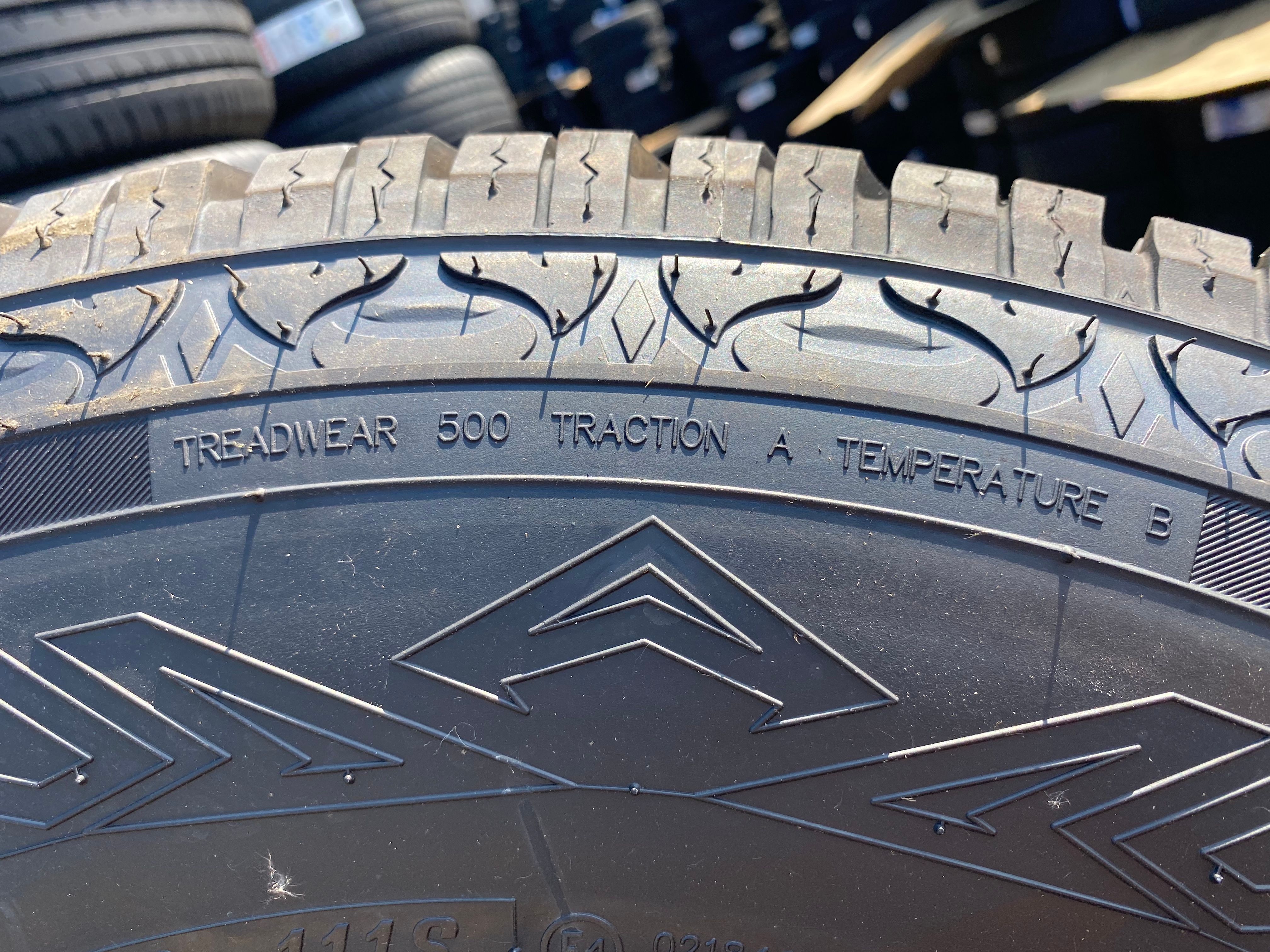 a close up of a tire sidewall showing the treadwear rating